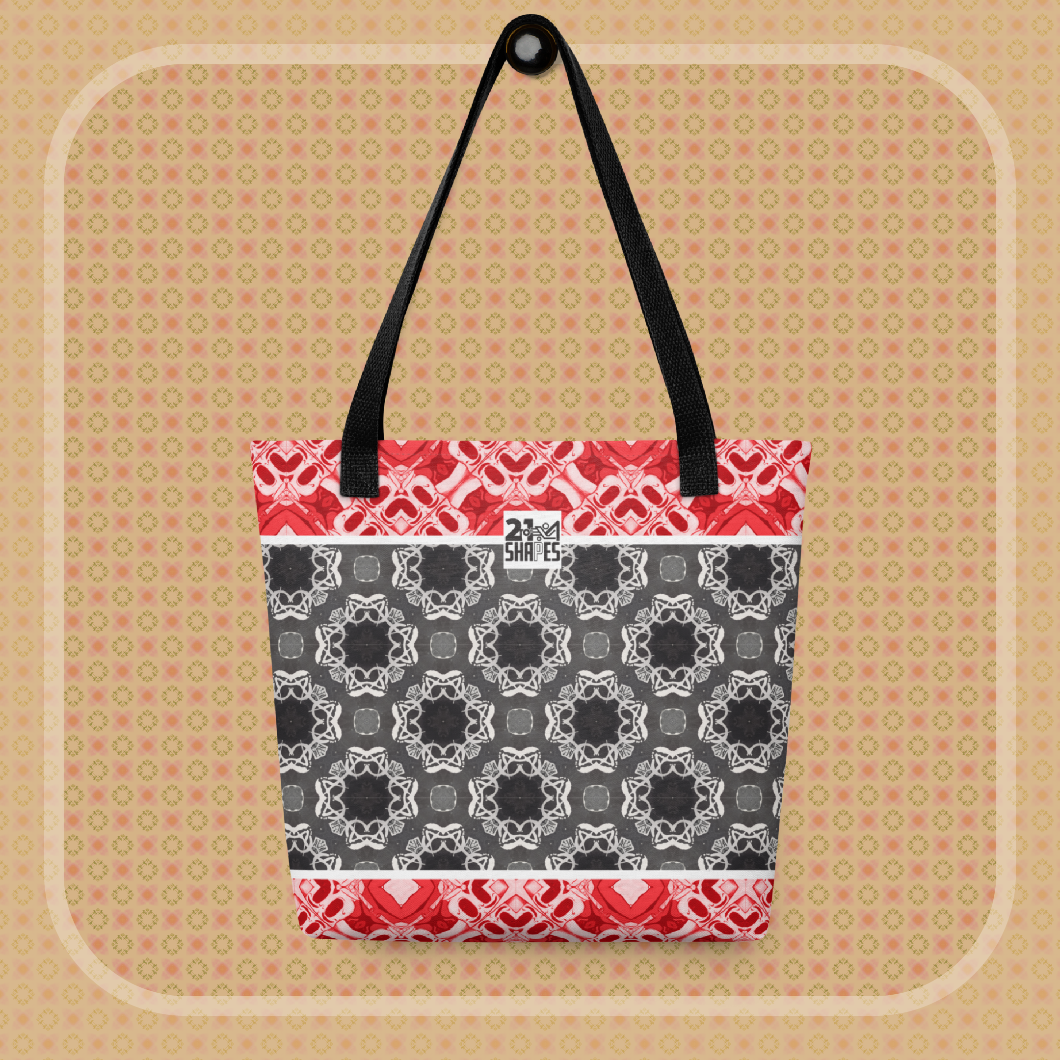 Tote bag with red, black, and white geometric pattern on a beige background