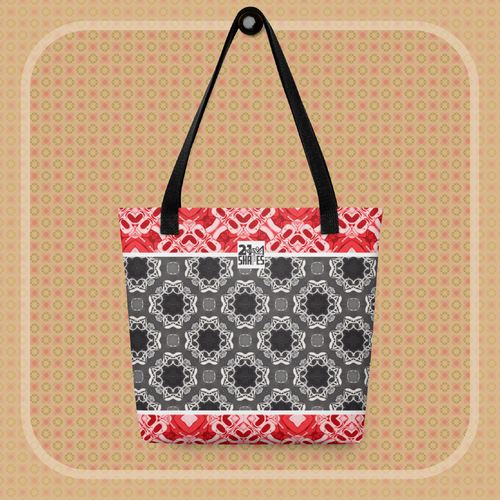 Tote bag with red, black, and white geometric pattern on a beige background