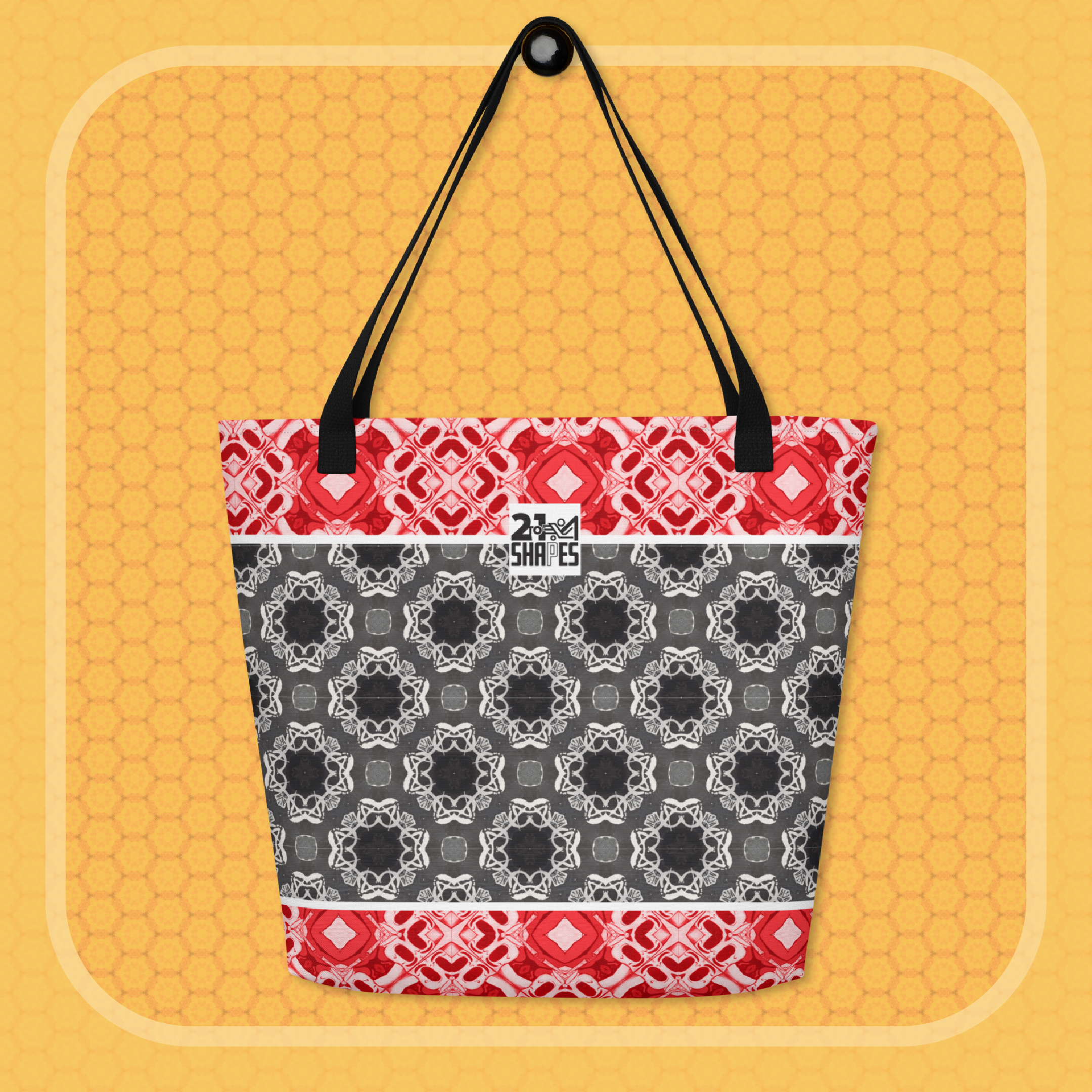Tote bag with red, black, and white geometric pattern on a yellow background