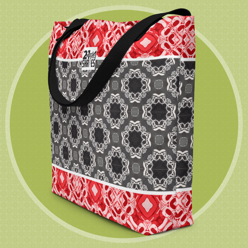 Tote bag with red, black, and white geometric pattern on a green background