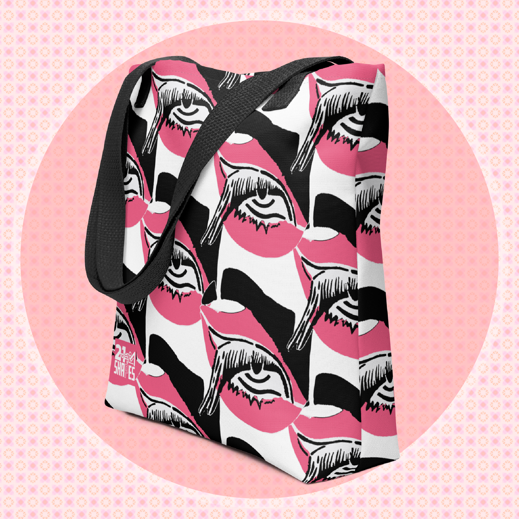 Tote bag with black, white and pink design of a repeating eye on a pink background