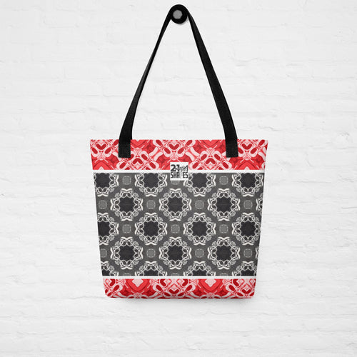 Tote bag with geometric pattern and red accents on a white background